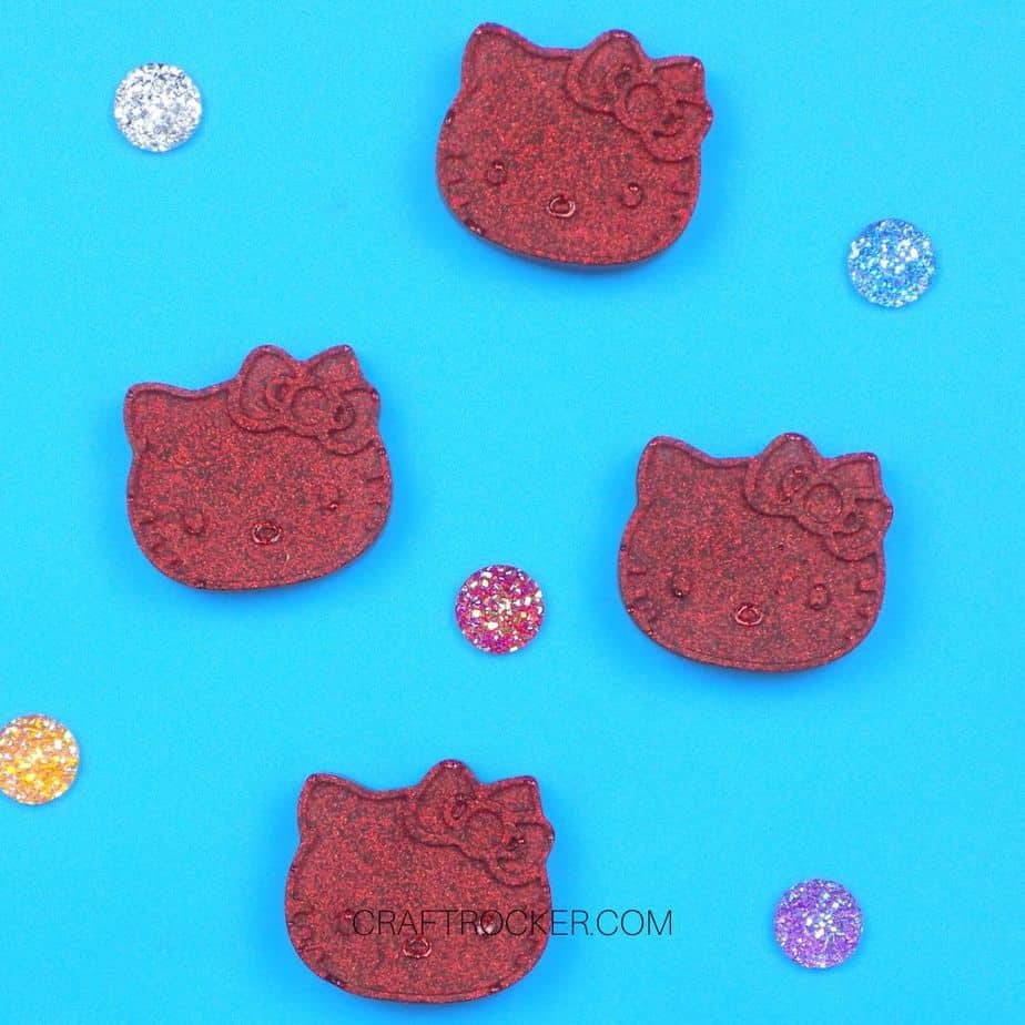 Hello Kitty Resin Magnets DIY next to Gems - Craft Rocker