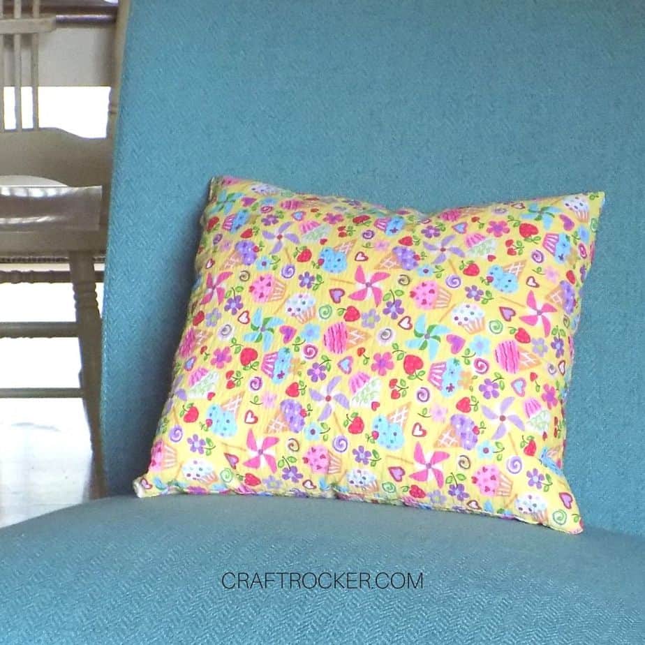 Colorful Sewn Pillow on Upholstered Chair - Craft Rocker