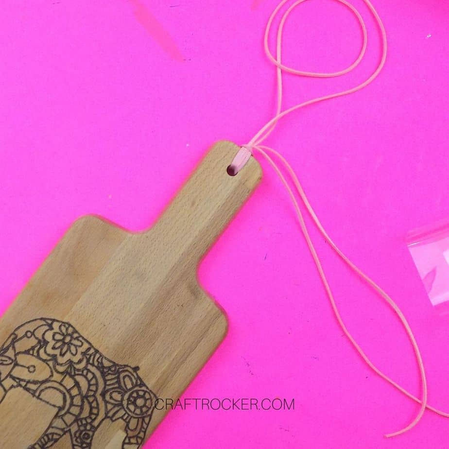 Cording attached to Wood Burned Cutting Board - Craft Rocker