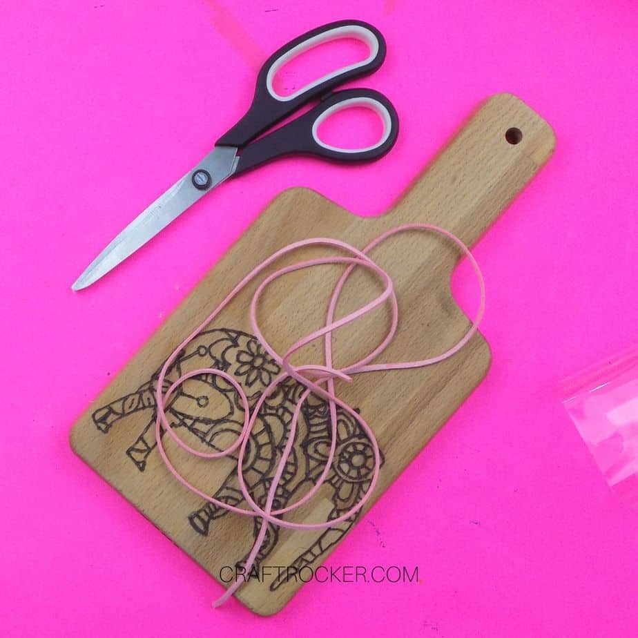 Cut Cording on top of Wood Burned Cutting Board - Craft Rocker