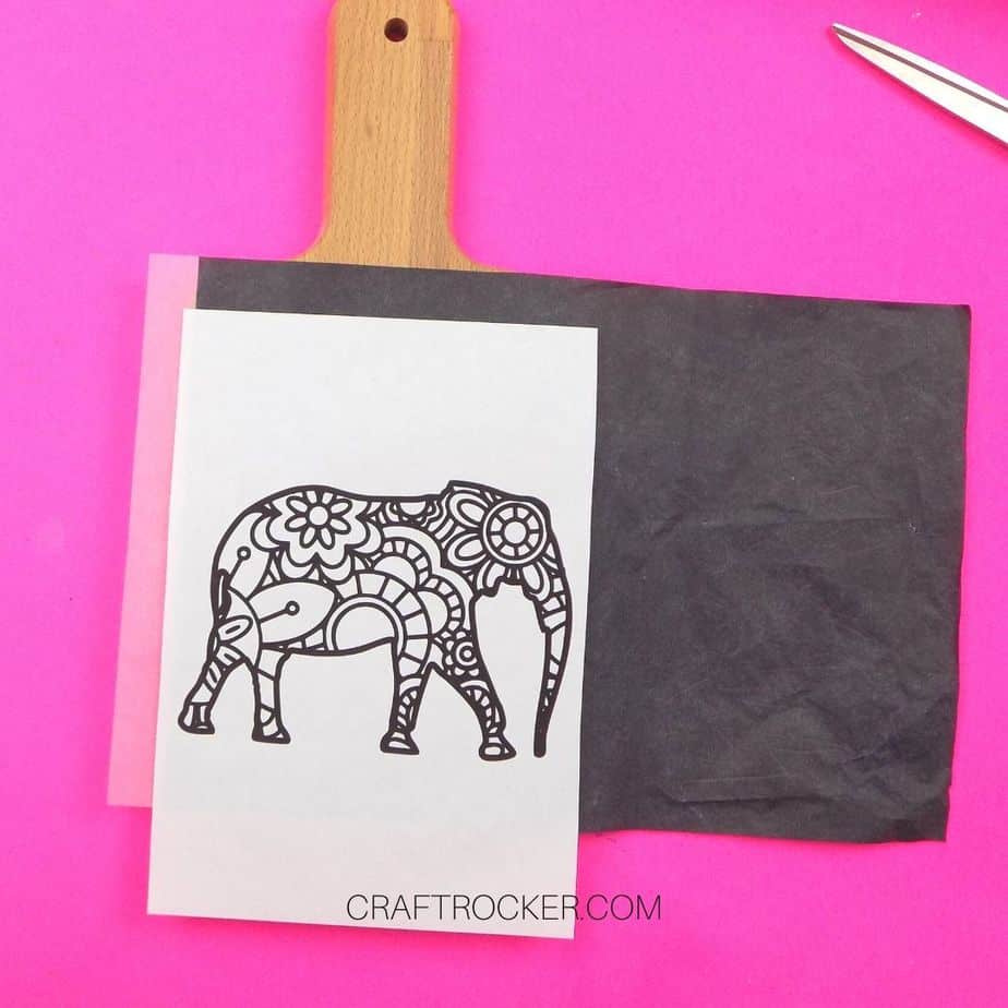 Elephant Picture and Carbon Paper on top of Wood Cutting Board - Craft Rocker