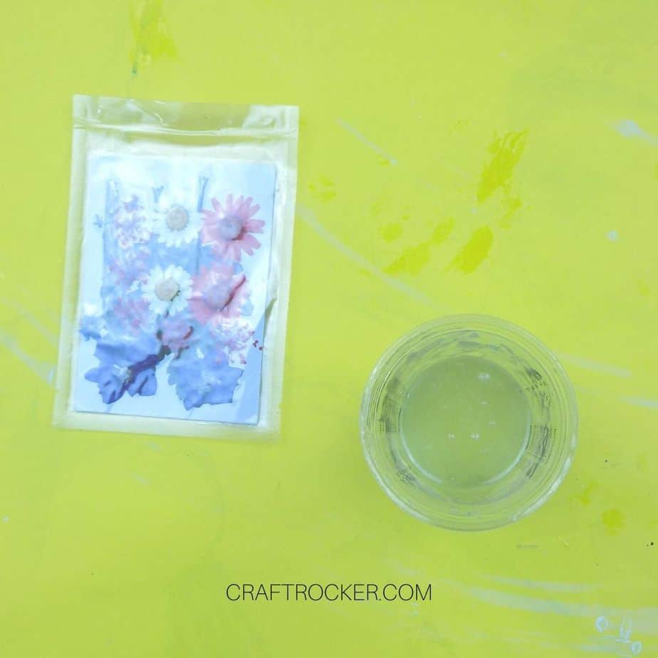 Pressed Flowers next to Resin Filled Measuring Cup - Craft Rocker
