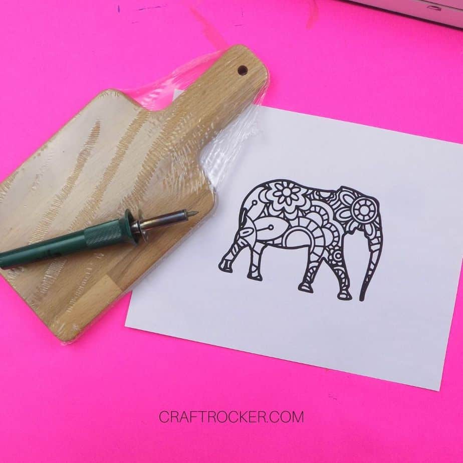 Small Wooden Cutting Board next to Wood Burning Tool and Elephant Picture - Craft Rocker