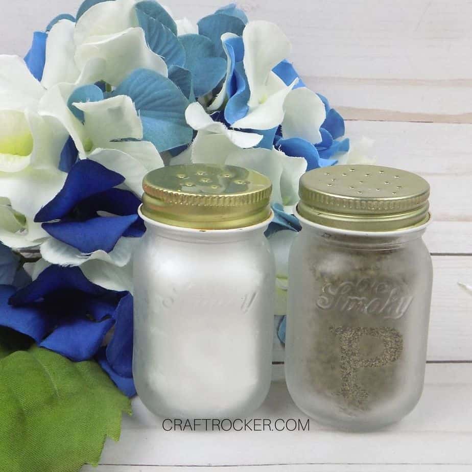 Close Up of Mini Mason Jar Salt and Pepper Shakers next to Flowers - Craft Rocker