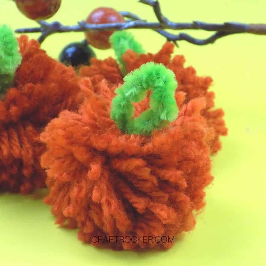 Close Up of Yarn Pumpkin Pom Pom - Craft Rocker