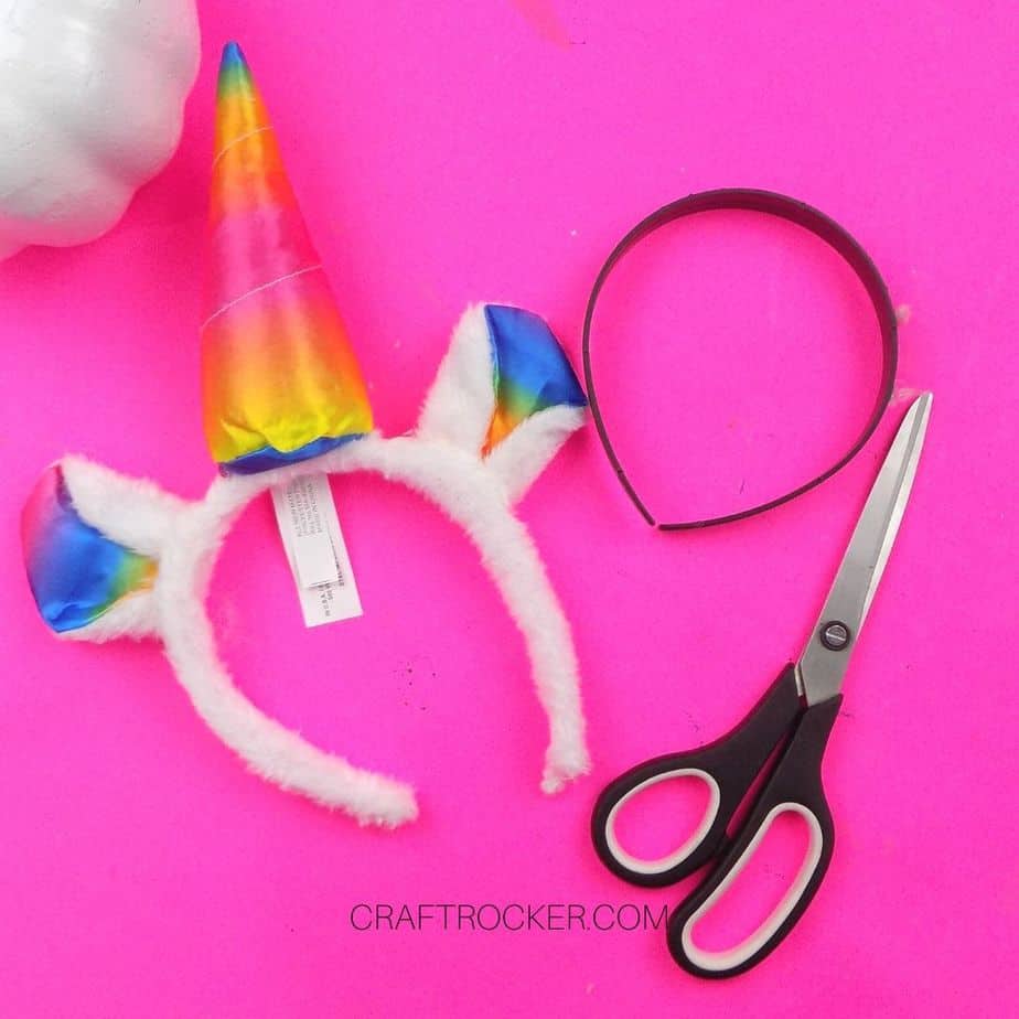 Plastic Headband Removed from Unicorn Piece next to Scissors - Craft Rocker