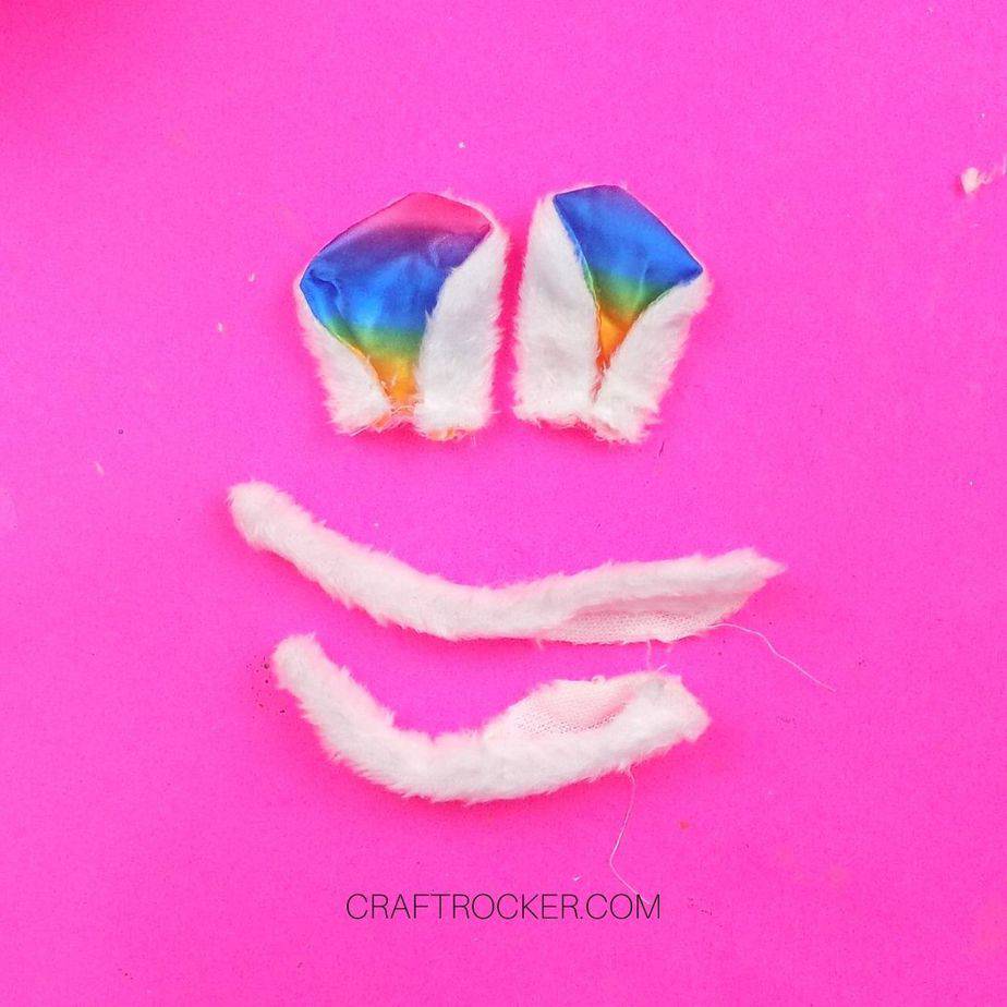 Rainbow Ears next to Pieces of White Fur - Craft Rocker