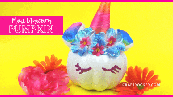 Rainbow Unicorn Pumpkin next to Flowers with text overlay - Mini Unicorn Pumpkin - Craft Rocker