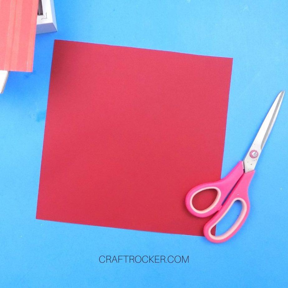 9x9 Piece of Red Cardstock next to Scissors - Craft Rocker