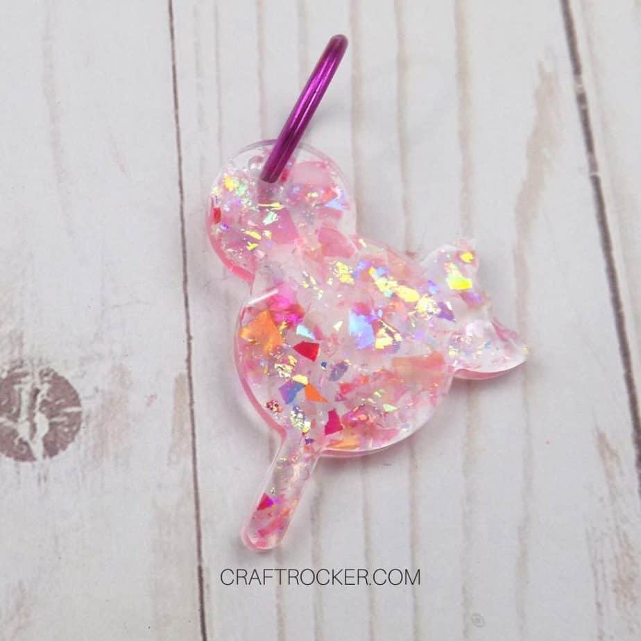 Close Up of Glitter Resin Mickey Popsicle Keychain on Wood Background - Craft Rocker