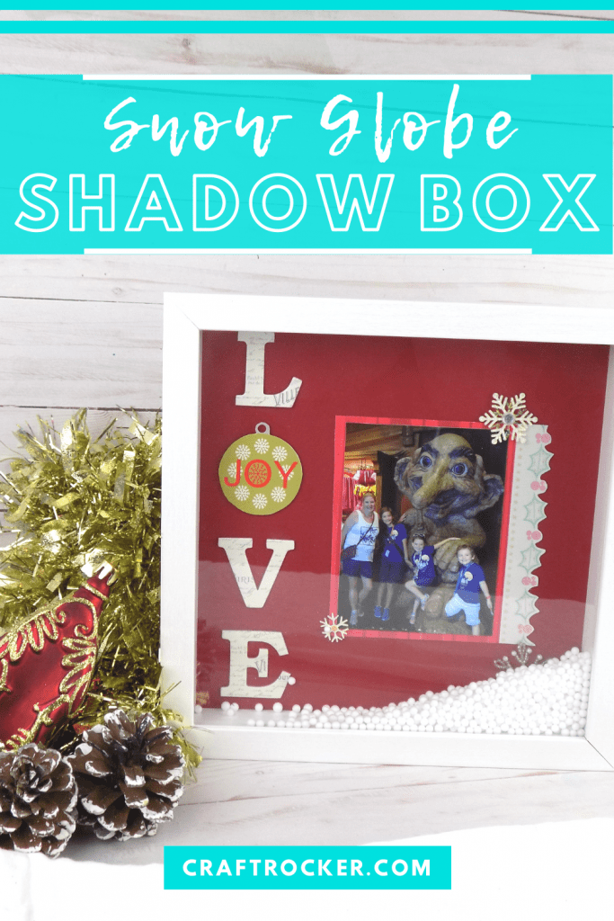 Love Shadow Box next to Garland and Christmas Ornaments with text overlay - Snow Globe Shadow Box - Craft Rocker