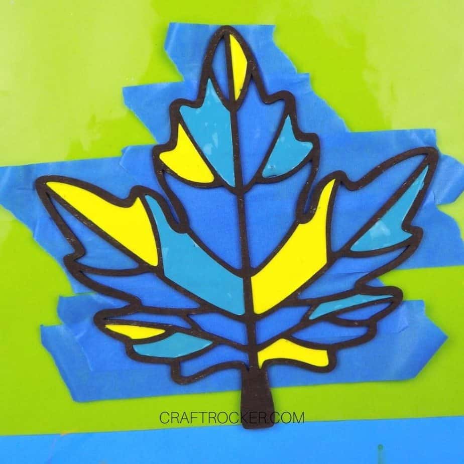 Yellow and Teal Paint Inside Sections of Painted Wood Leaf - Craft Rocker