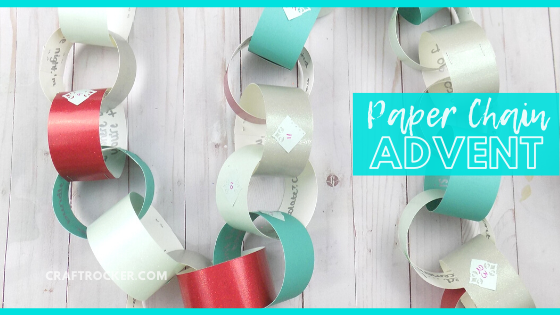 Close Up Numbered Paper Chain on Wood Background with text overlay - Paper Chain Advent - Craft Rocker