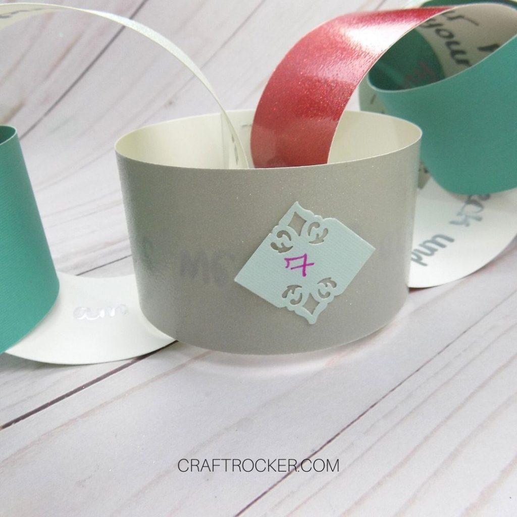 Close Up of Paper Chain Link with the Number 7 on It - Craft Rocker