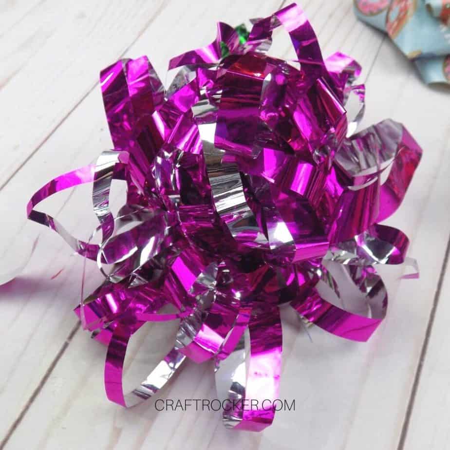 Close Up of Pink Foil Fringe Wrapping Paper Bow - Craft Rocker