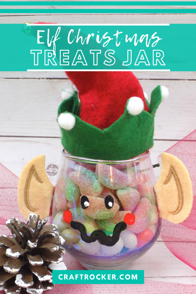 Close Up of Treat Jar next to Pine Cone with text overlay - Elf Christmas Treats Jar - Craft Rocker