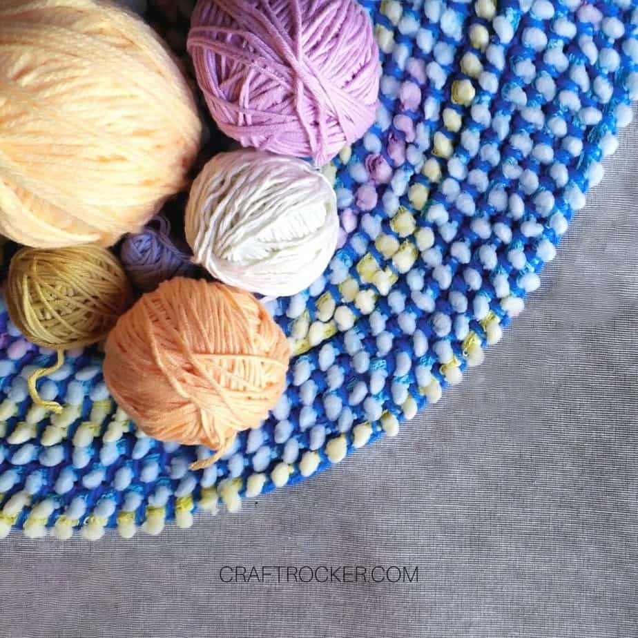 Colorful Balls of Yarn on a Rug - Craft Rocker