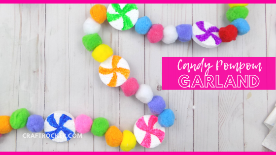 Colorful Candy Garland on Wood Background with text overlay - Candy Pompom Garland - Craft Rocker