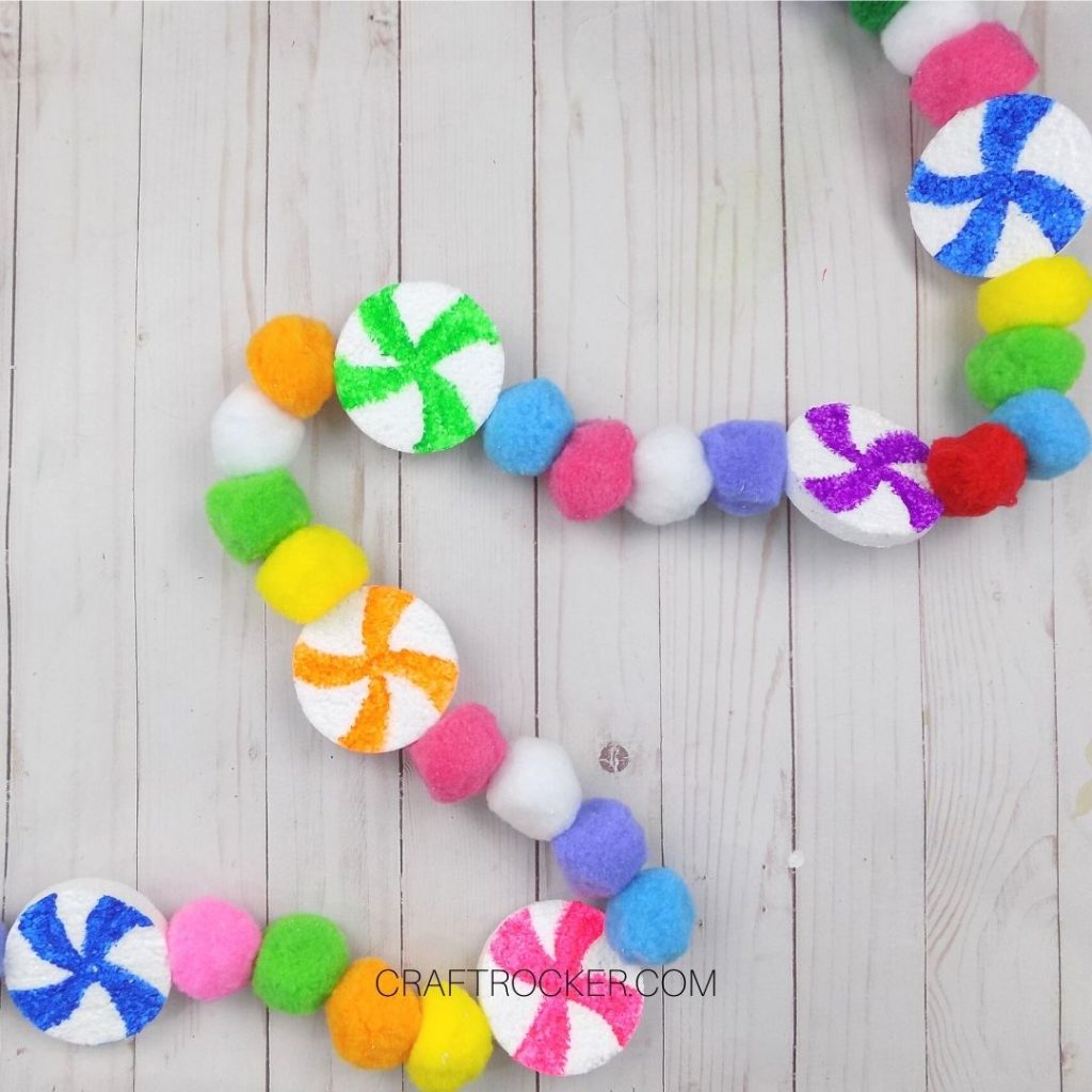 Colorful Candy Pompom Garland on Wood Background - Craft Rocker