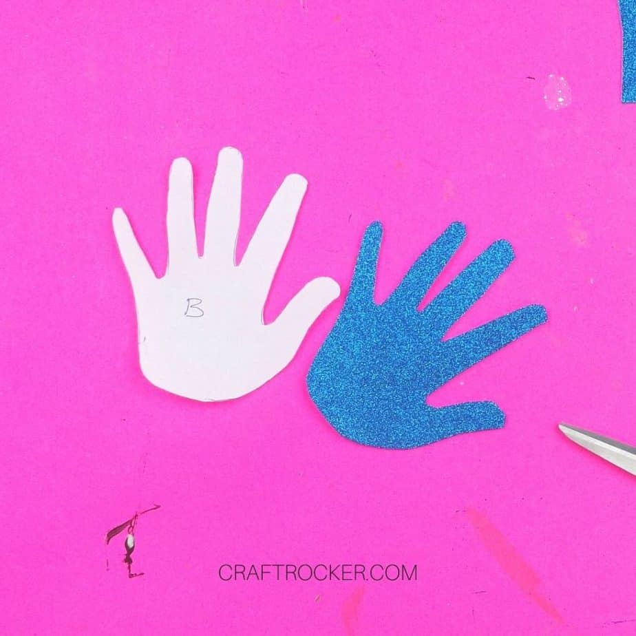 Paper Handprint Cutout next to Glitter Foam Handprint - Craft Rocker