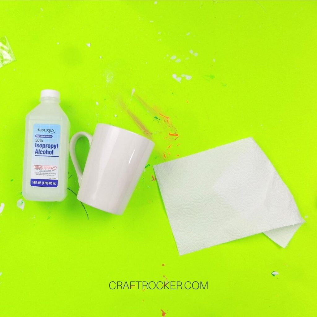 Rubbing Alcohol next to White Mug and Paper Towel - Craft Rocker