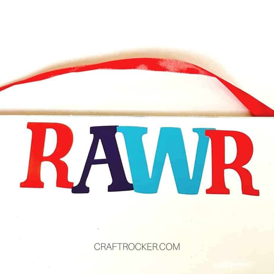 Close Up of Letter Stickers RAWR Attached to Center of Wood Sign - Craft Rocker