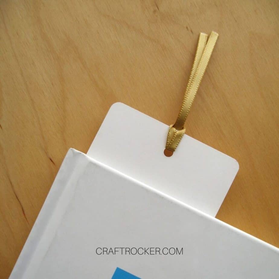 Close Up of Paper Bookmark Sticking Out of Top of Book - Craft Rocker