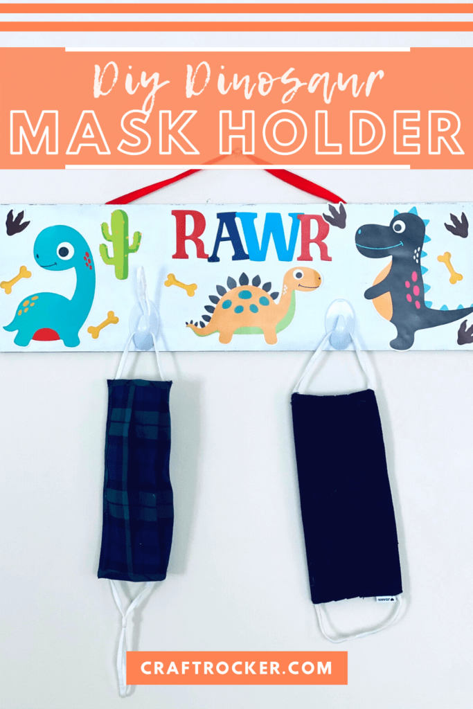 Hanging Mask Holder with Masks on it with text overlay - DIY Dinosaur Mask Holder - Craft Rocker