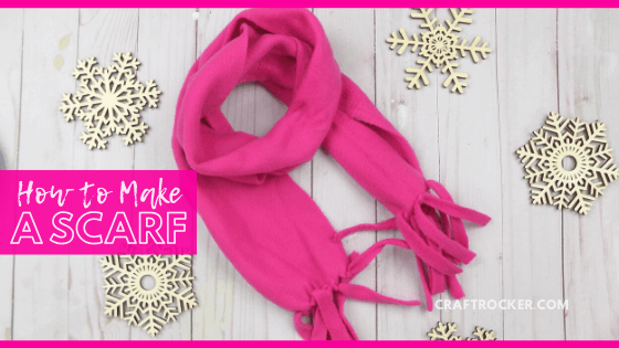 Pink Fleece Scarf next to Wood Snowflakes with text overlay - How to Make a Scarf - Craft Rocker