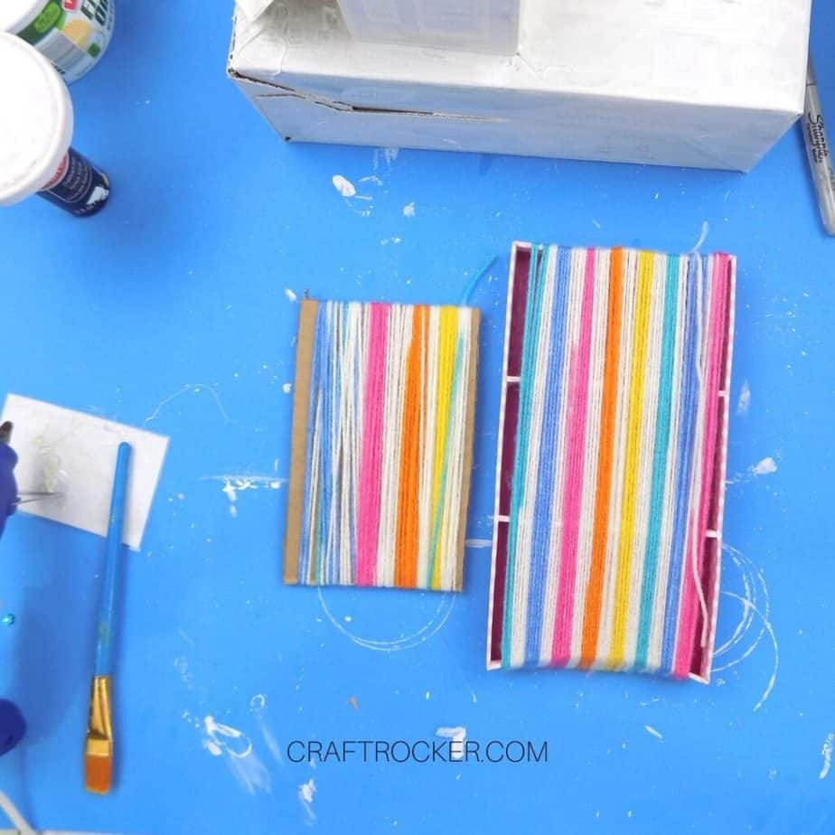 Rainbow Yarn Wrapped Around A Large and a Small Cardboard Rectangle - Craft Rocker