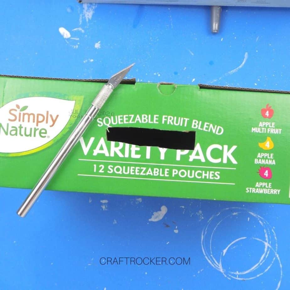 Rectangle Hole Cut in the Lid of an Applesauce Pouches Box - Craft Rocker