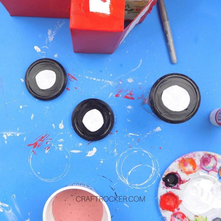 Black Paint on Outer Edge of White Salsa Lids - Craft Rocker