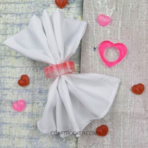 White Napkin in a Heart Napkin Ring next to Pink Heart Napkin Ring - Craft Rocker