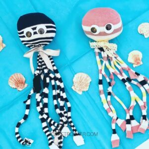 Striped Octopus Toys on Blue Background Next to Shells - Craft Rocker
