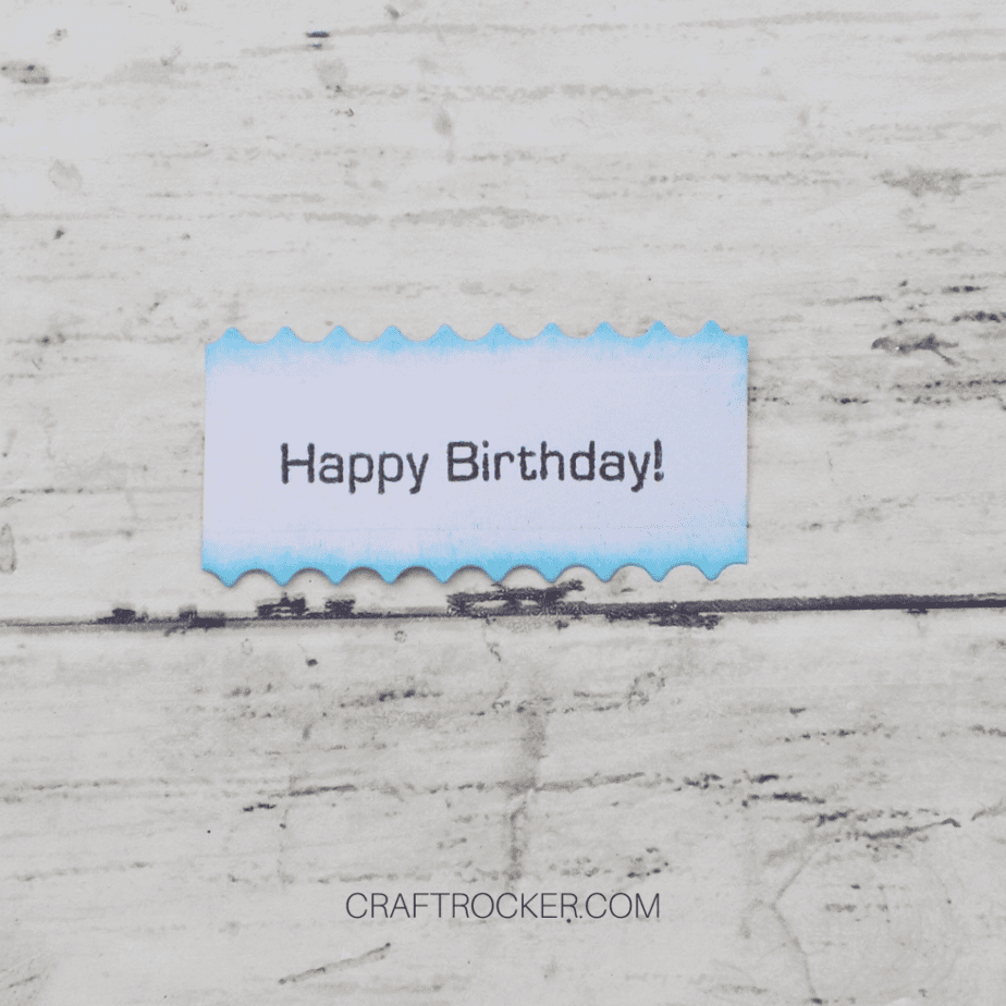 Close Up of Happy Birthday Stamped on Small Scalloped Piece of Paper - Craft Rocker