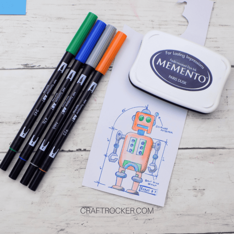 Tombow Markers and Ink Pad next to Colored Robot Image - Craft Rocker