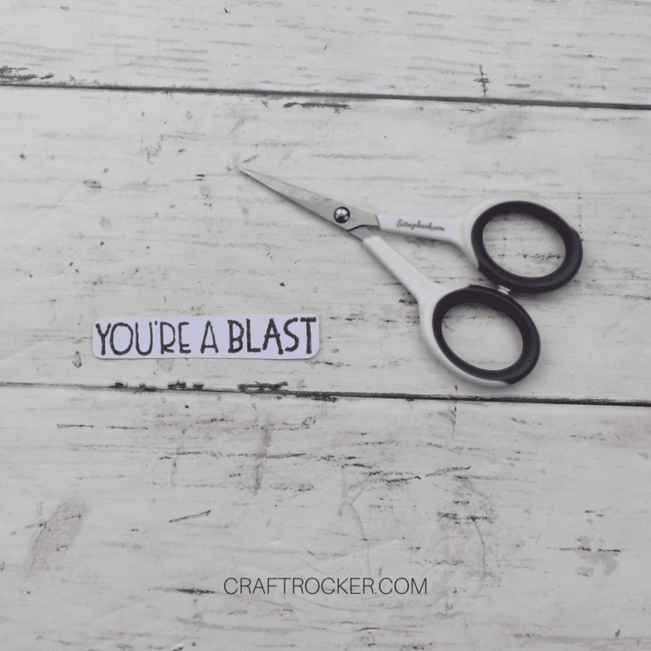 Close Up of Cut Out You're a Blast Sentiment next to Detail Scissors - Craft Rocker