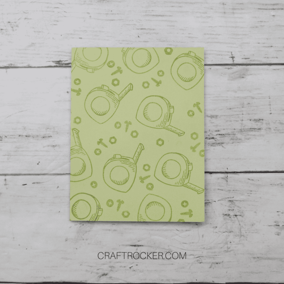 Close Up of Green Card Stamped with Tape Measures and Screws - Craft Rocker