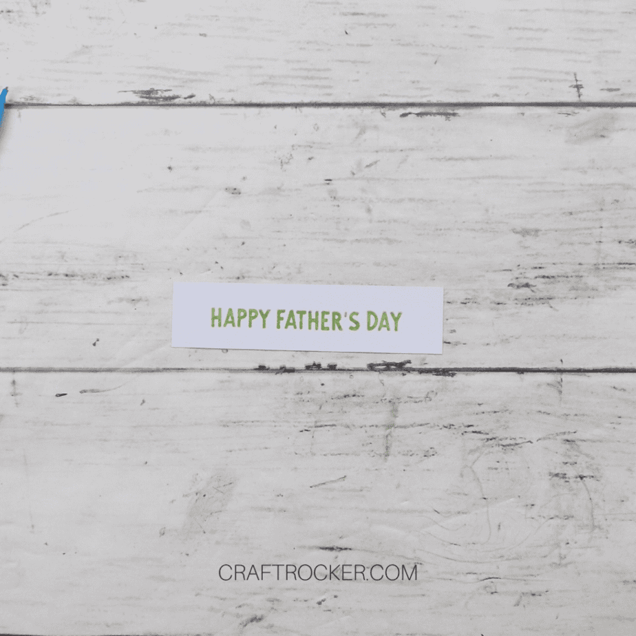 Close Up of Happy Father's Day Stamped on White Strip of Paper - Craft Rocker