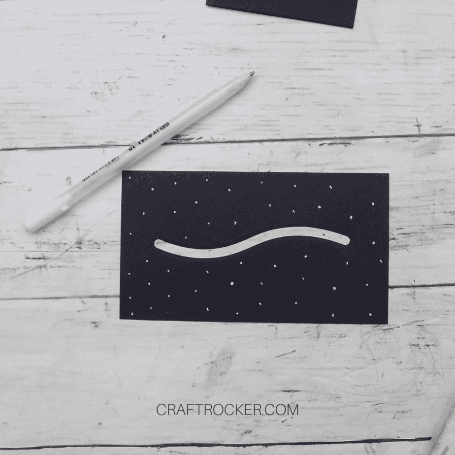 Close Up of White Dots on Slider Die Cut Cardstock Next to Gel Pen - Craft Rocker