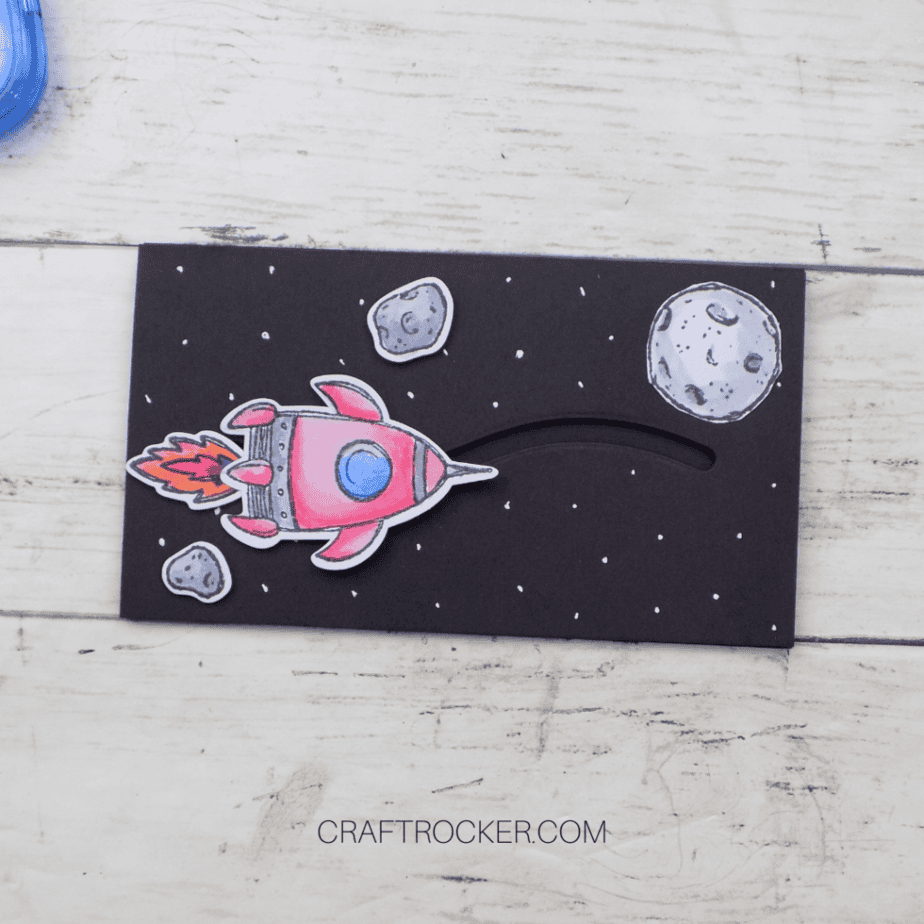 Meteors and Moon Glued to Spaceship Slider Card Front - Craft Rocker